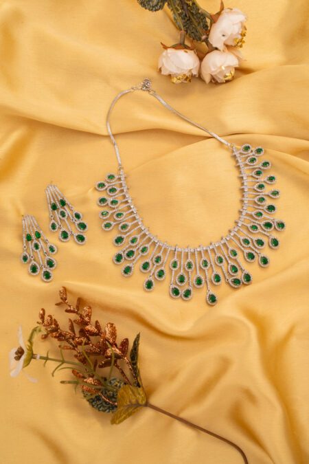 Tiny Green Stones on White Gold AD base gives an charming look