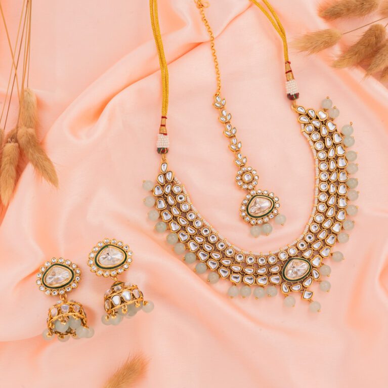 Sky Blue Beads with Kundan paired with Jhumki on Gold Base